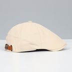 Unisex flat cap with curved flap and textured top