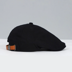 Unisex flat cap with curved flap and textured top